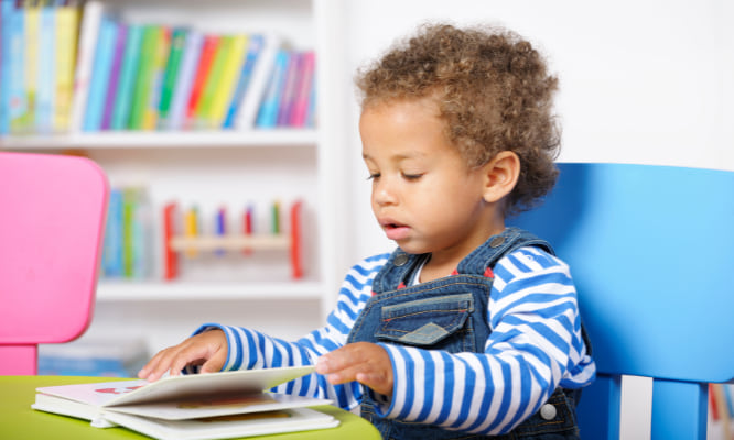 toddler reading a book